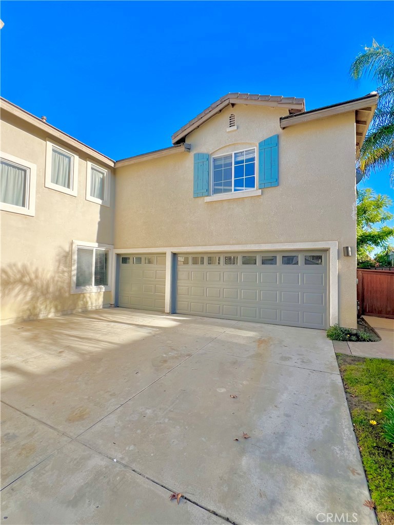 27145 Cherry Grove Court Temecula, CA 92591 - Photo 8 of 61 a front view of a house with a yard