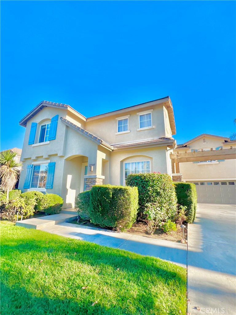 27145 Cherry Grove Court Temecula, CA 92591 - Photo 9 of 61 a front view of a house with a yard