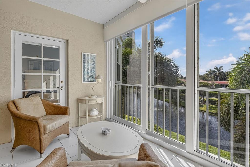 6537 Marissa Loop, Unit 4 Naples, FL 34108 - Photo 12 of 30 a living room with furniture and a window