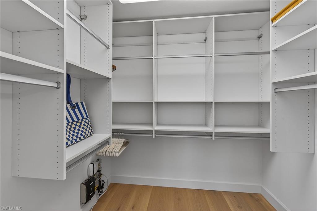 6537 Marissa Loop, Unit 4 Naples, FL 34108 - Photo 17 of 30 a view of walk in closet with empty racks
