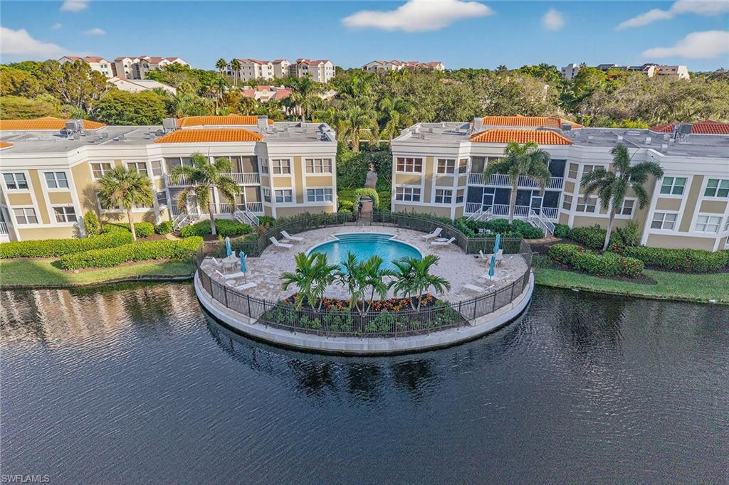 6537 Marissa Loop, Unit 4 Naples, FL 34108 - Photo 25 of 30 an aerial view of a house with swimming pool and a yard