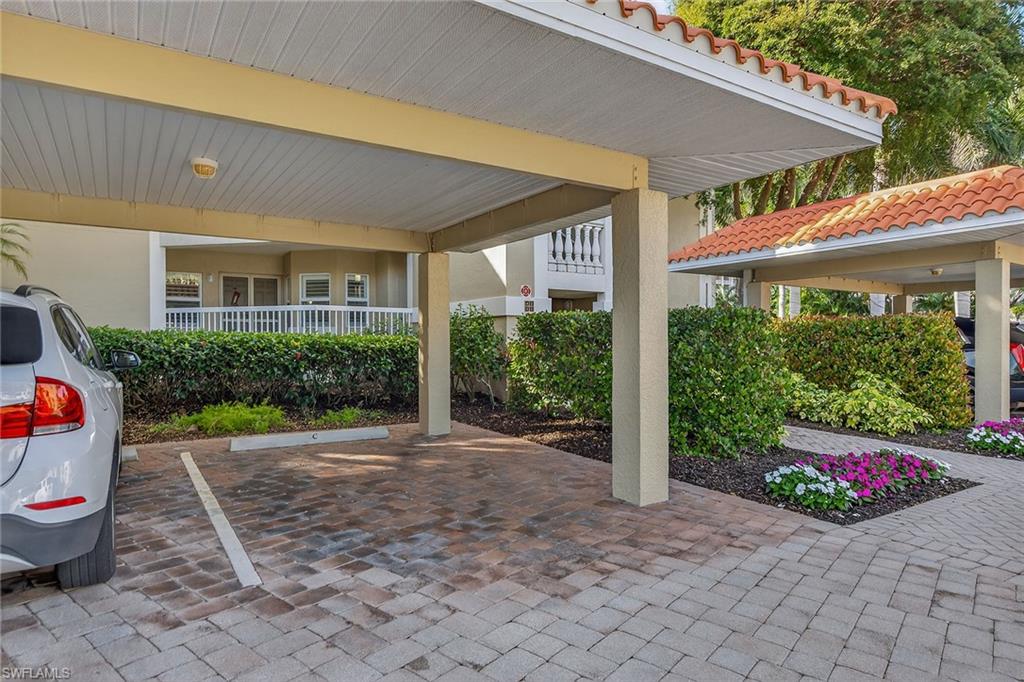 6537 Marissa Loop, Unit 4 Naples, FL 34108 - Photo 29 of 30 a view of a backyard with garden