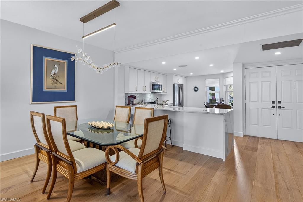 6537 Marissa Loop, Unit 4 Naples, FL 34108 - Photo 8 of 30 a dining room with furniture and window