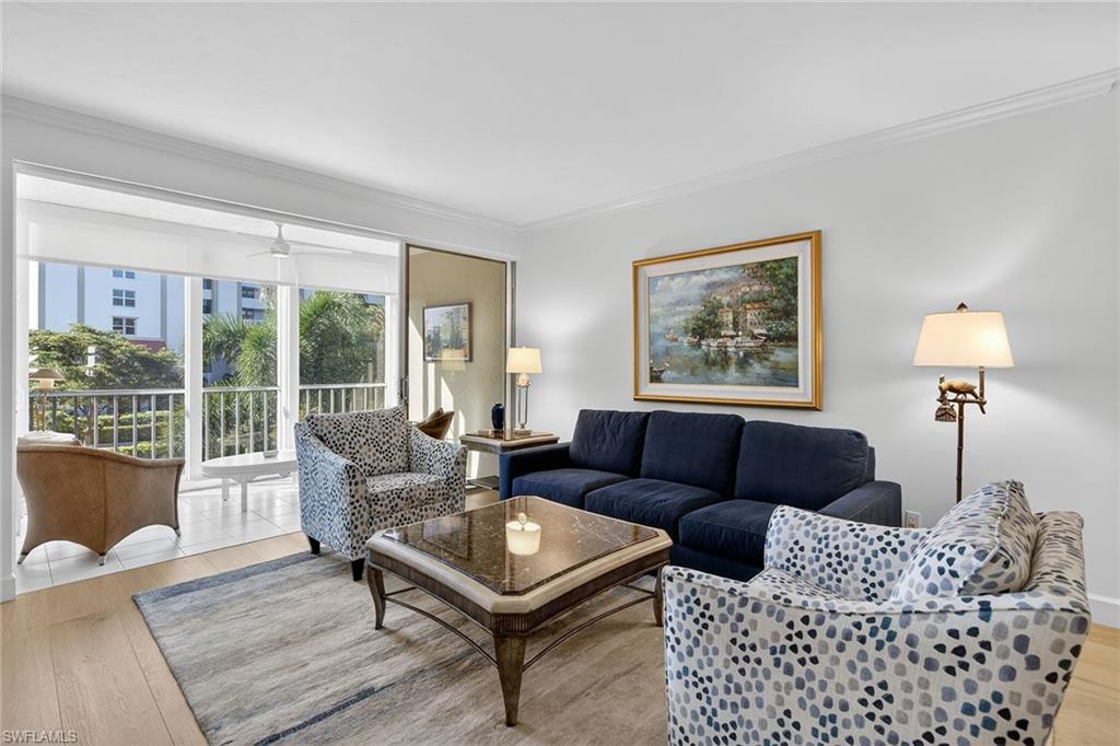 6537 Marissa Loop, Unit 4 Naples, FL 34108 - Photo 10 of 30 a living room with furniture and a window