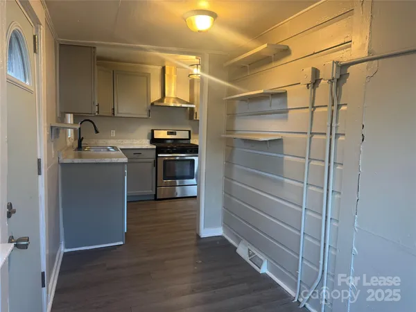 a kitchen with kitchen island cabinets and stainless steel appliances