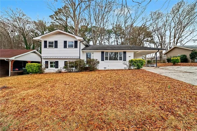 a front view of a house with a yard