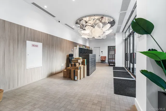 a front view of a residential apartment building with a yard