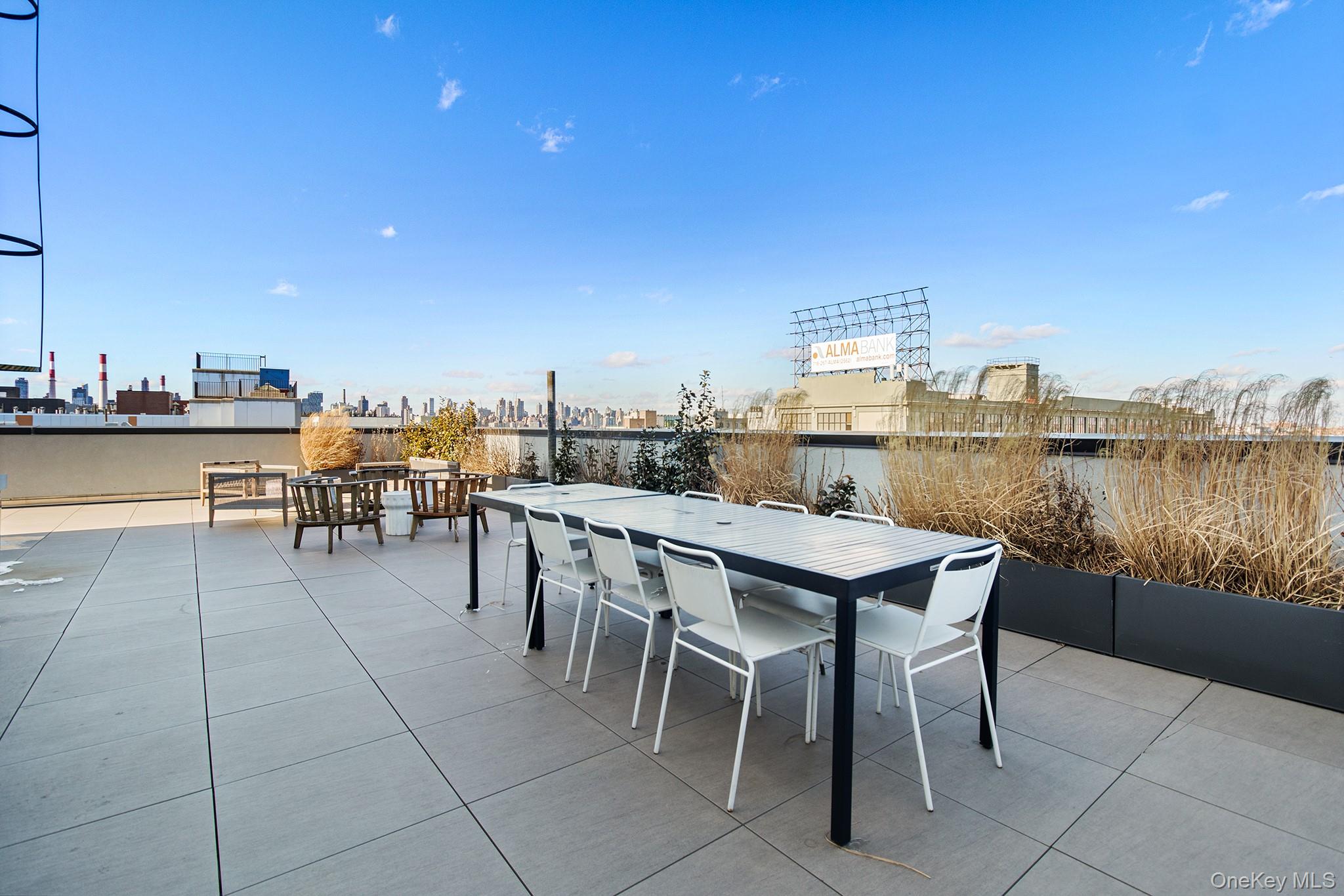 37-14 34th Street, Unit N3E Queens, NY 11101 - Photo 10 of 25 View of patio / terrace featuring exterior bar