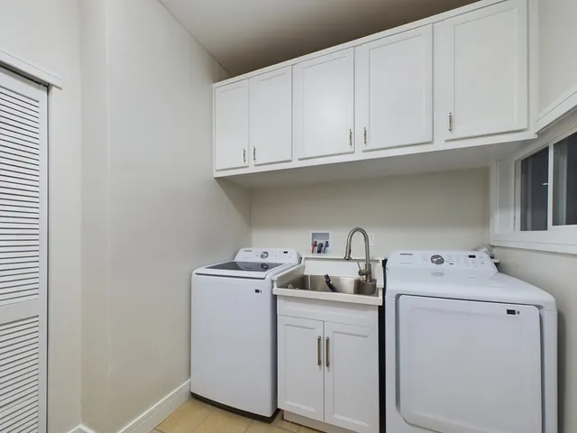a utility room with dryer and washer