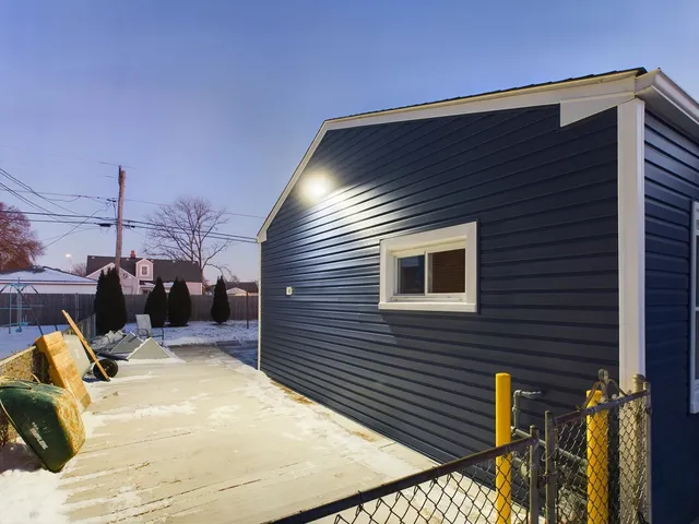 a backyard of a house with seating space