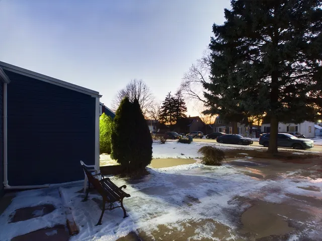 a view of a backyard with sitting area