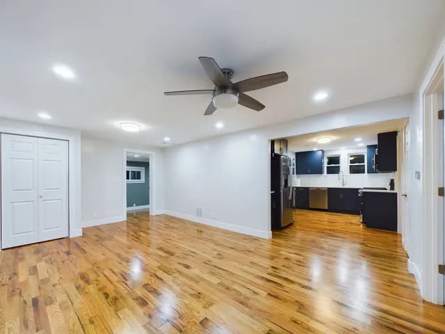 a view of a livingroom with a kitchen