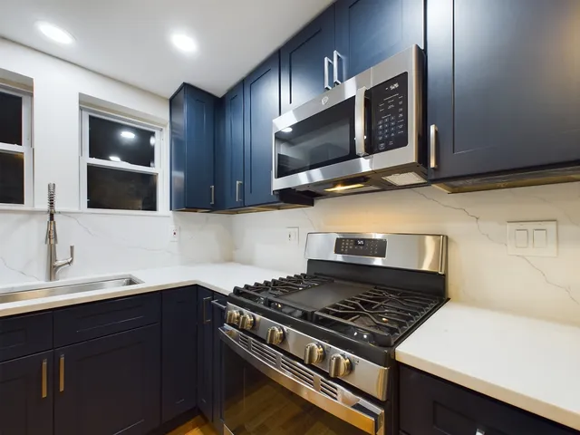 a kitchen with a stove and a microwave