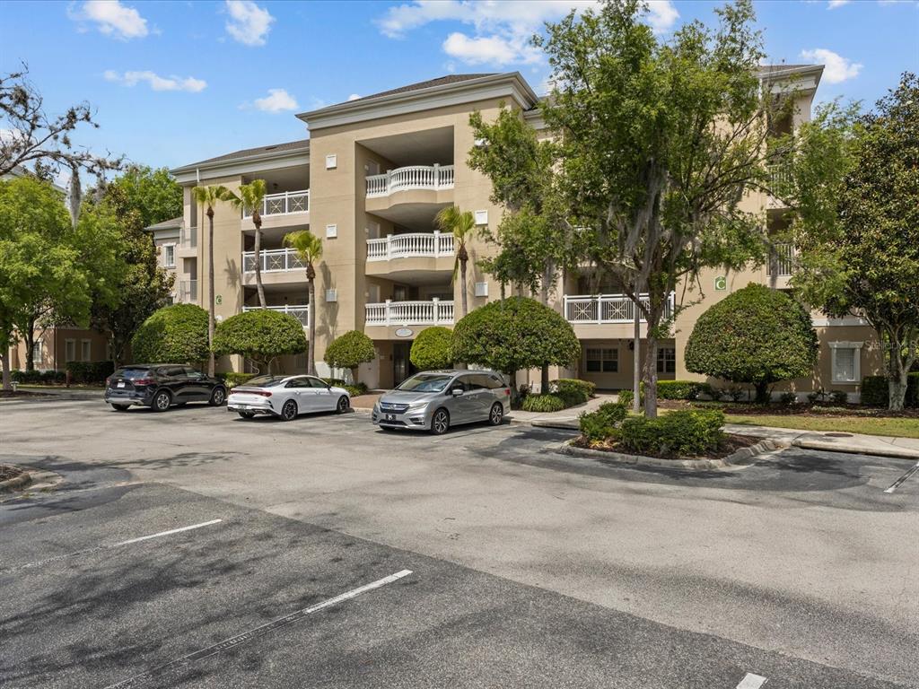 1354 Centre Ct Ridge Drive, Unit 302 Reunion, FL 34747 - Photo 1 of 33 a view of a street with a cars parked in front of it