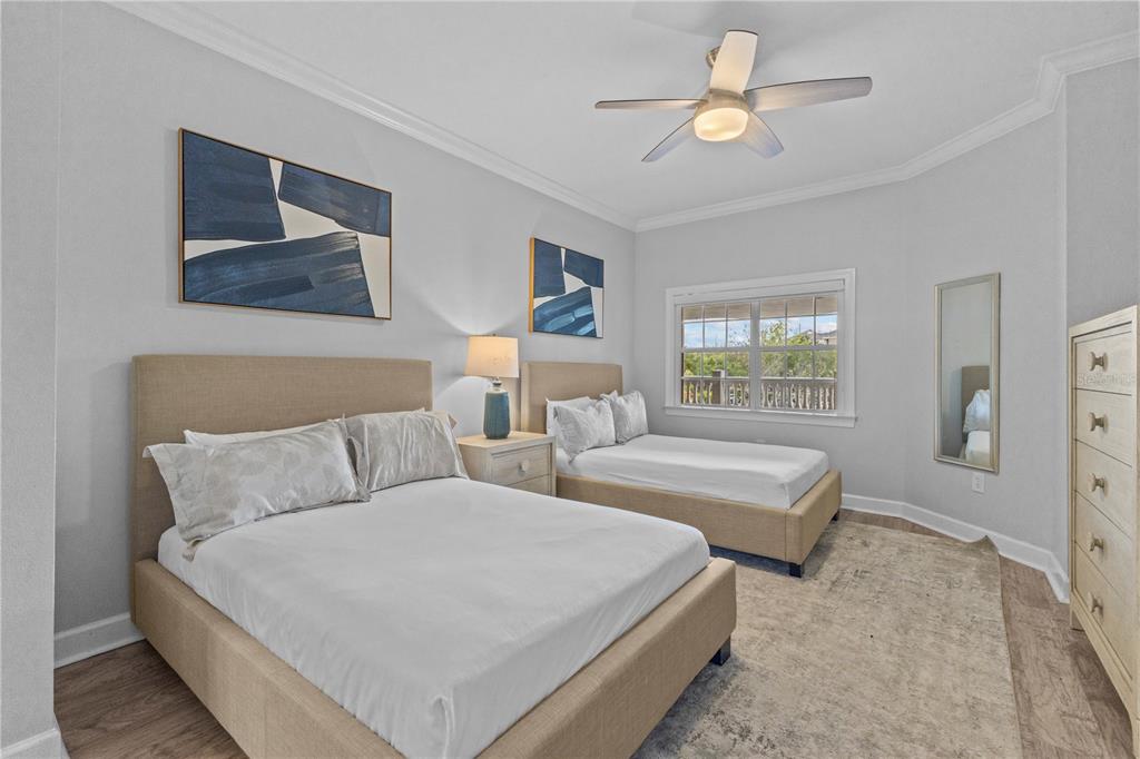 1354 Centre Ct Ridge Drive, Unit 302 Reunion, FL 34747 - Photo 16 of 33 a bed room with bed and a chandelier