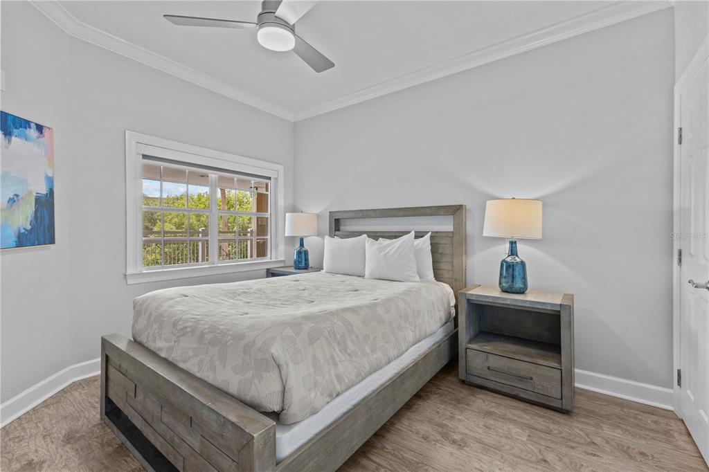 1354 Centre Ct Ridge Drive, Unit 302 Reunion, FL 34747 - Photo 21 of 33 a bedroom with a bed and window