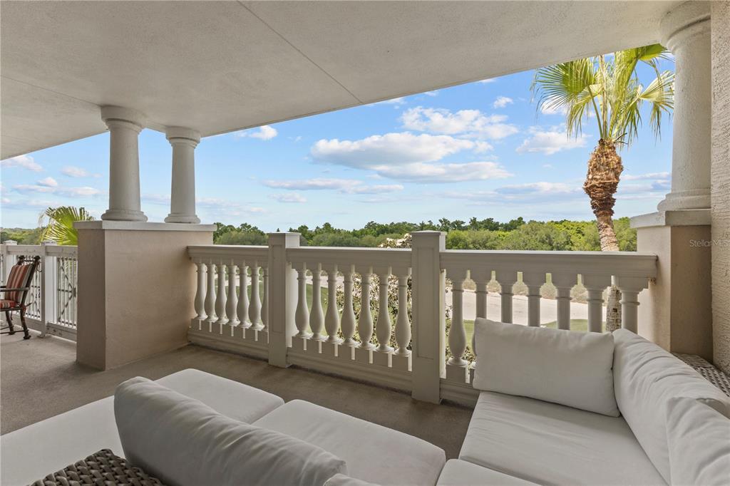 1354 Centre Ct Ridge Drive, Unit 302 Reunion, FL 34747 - Photo 27 of 33 a balcony with furniture