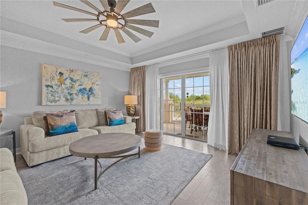 1354 Centre Ct Ridge Drive, Unit 302 Reunion, FL 34747 - Photo 8 of 33 a living room with furniture and a large window