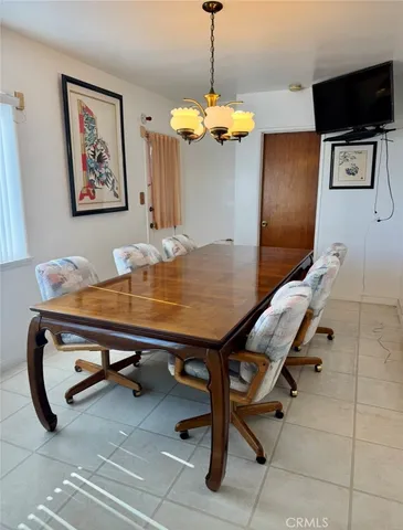 a room with pool table and flat screen tv