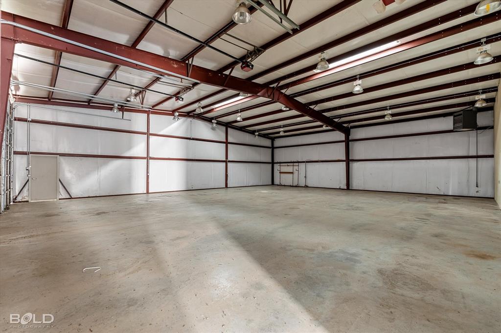 10099 Ferry Lake Road Oil City, LA 71061 - Photo 12 of 14 Impressive 5 bay garage/workshop offering endless possibilities.