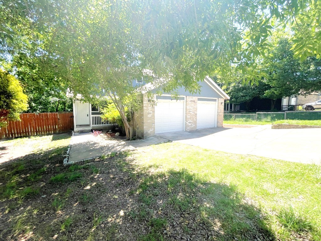 2003 Kenneth Avenue, Unit B Austin, TX 78741 - Photo 1 of 1 a view of a house with a yard and a large tree