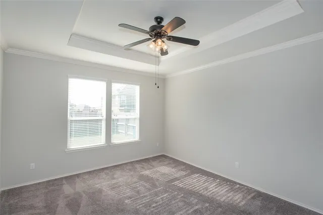 a view of a livingroom with a ceiling fan and window