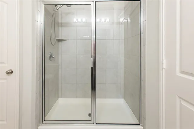 a view of a livingroom with a ceiling fan and window