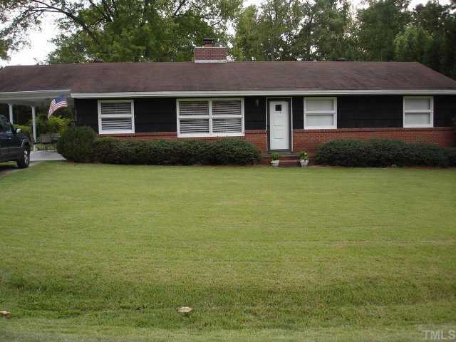 3704 Lee Road Raleigh, NC 27604 - Photo 1 of 12 a front view of a house with yard and outdoor seating