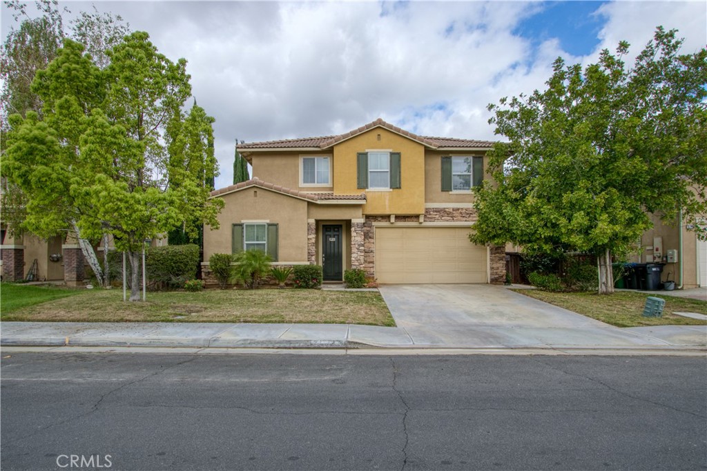 37192 High Ridge Drive Beaumont, CA 92223 - Photo 2 of 71 a view of a house with a yard and large tree