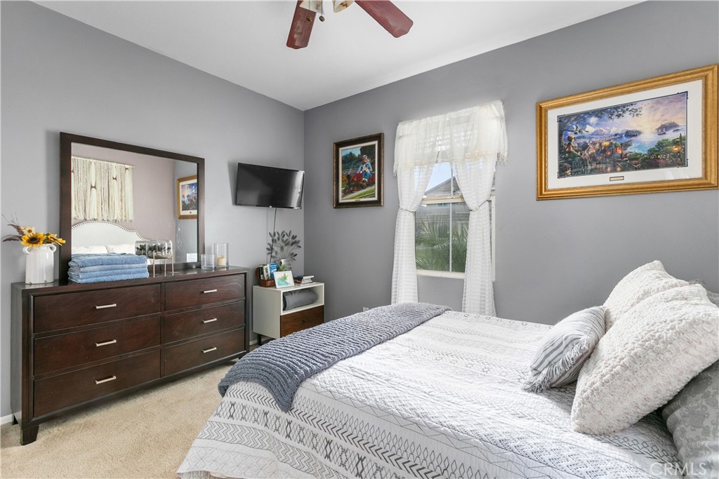 37192 High Ridge Drive Beaumont, CA 92223 - Photo 22 of 71 a bedroom with a bed and a window