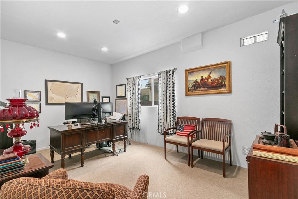 37192 High Ridge Drive Beaumont, CA 92223 - Photo 24 of 71 a living room with furniture and a flat screen tv