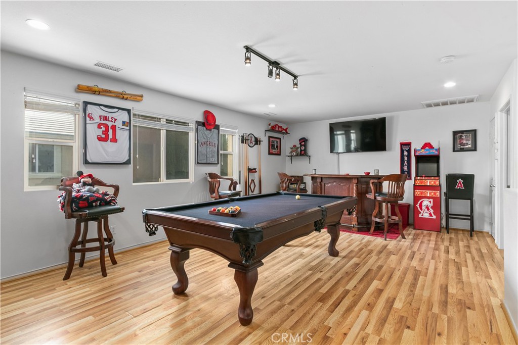 37192 High Ridge Drive Beaumont, CA 92223 - Photo 34 of 71 a living room with furniture and a flat screen tv