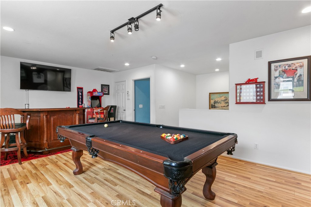 37192 High Ridge Drive Beaumont, CA 92223 - Photo 35 of 71 a living room with furniture pool table flat screen tv and windows