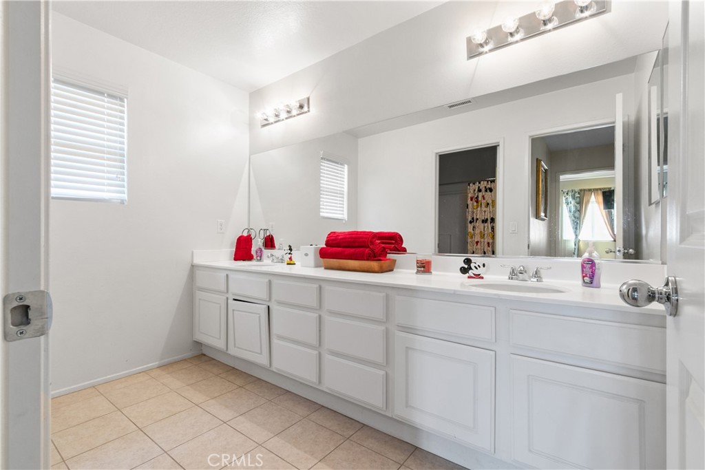 37192 High Ridge Drive Beaumont, CA 92223 - Photo 36 of 71 a bathroom with a sink vanity tub and a mirror