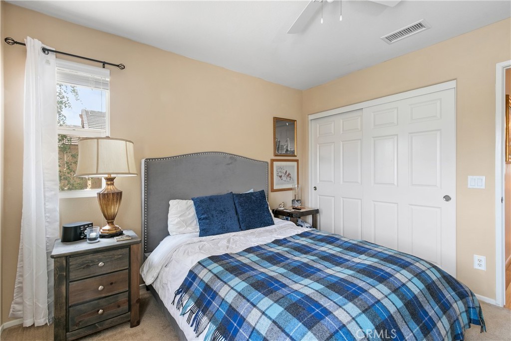 37192 High Ridge Drive Beaumont, CA 92223 - Photo 38 of 71 a bedroom with a bed and a window