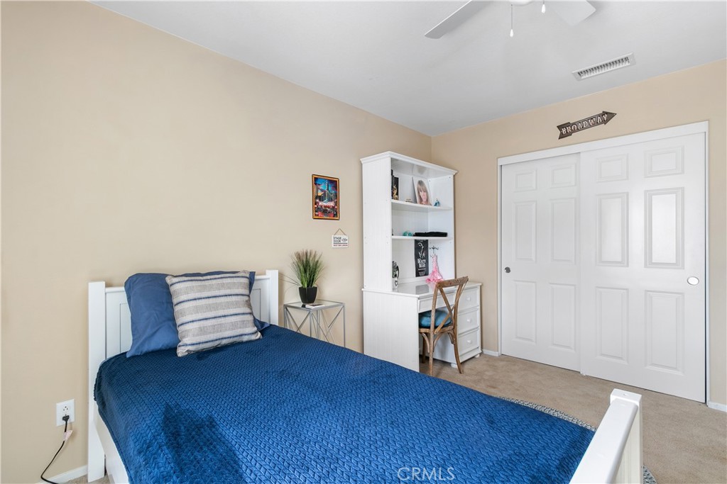 37192 High Ridge Drive Beaumont, CA 92223 - Photo 41 of 71 a bedroom with furniture and a wooden floor