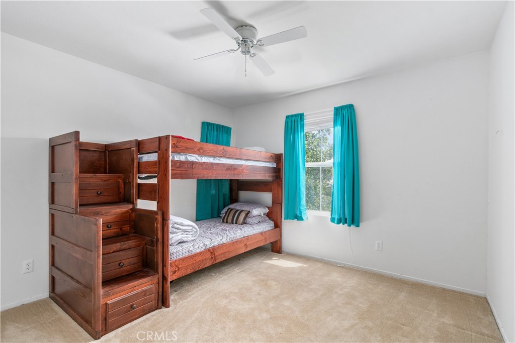 37192 High Ridge Drive Beaumont, CA 92223 - Photo 42 of 71 a bedroom with a bed and a window