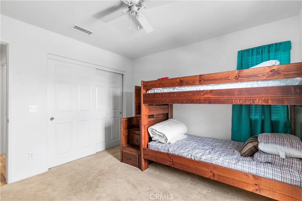 37192 High Ridge Drive Beaumont, CA 92223 - Photo 43 of 71 a bedroom with a bed and a window