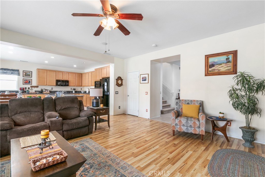 37192 High Ridge Drive Beaumont, CA 92223 - Photo 5 of 71 a living room with furniture and a wooden floor