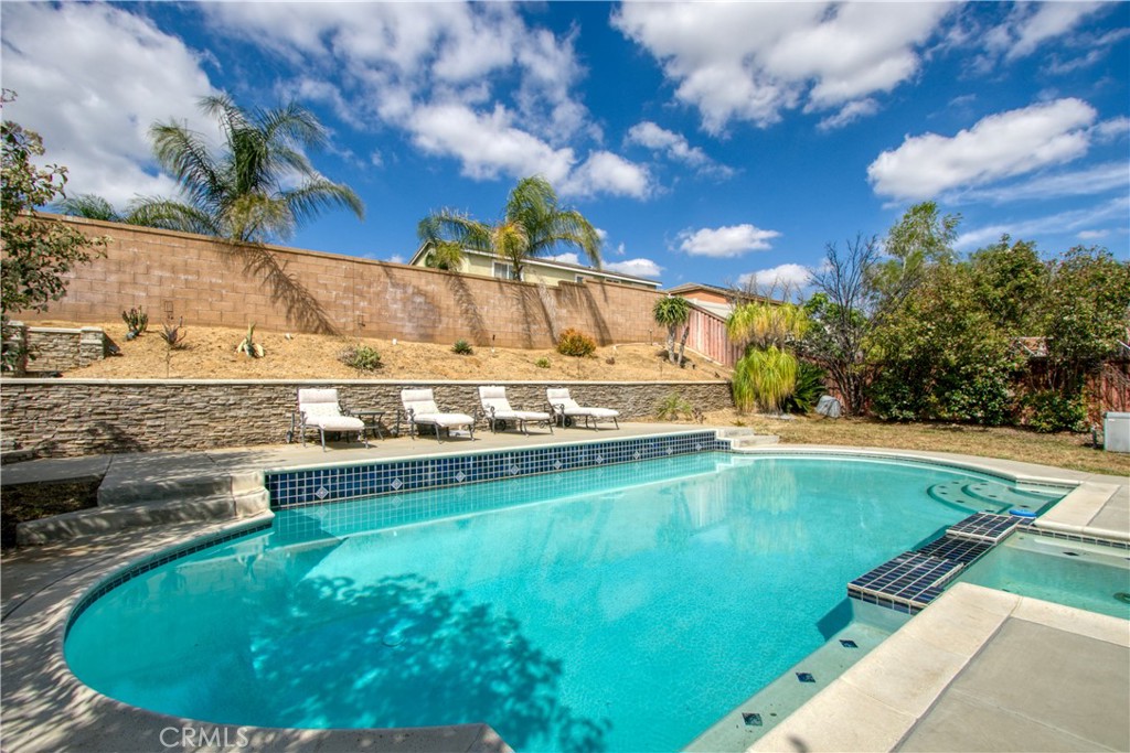 37192 High Ridge Drive Beaumont, CA 92223 - Photo 51 of 71 a view of a swimming pool with a yard