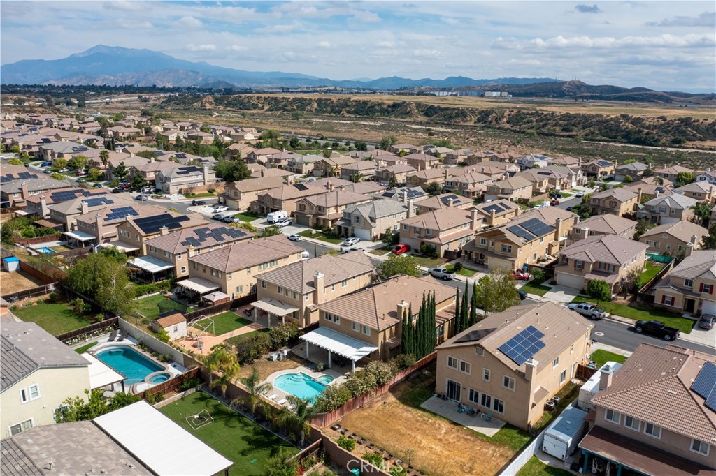 37192 High Ridge Drive Beaumont, CA 92223 - Photo 65 of 71 an aerial view of a city with lots of residential buildings and mountain view in back