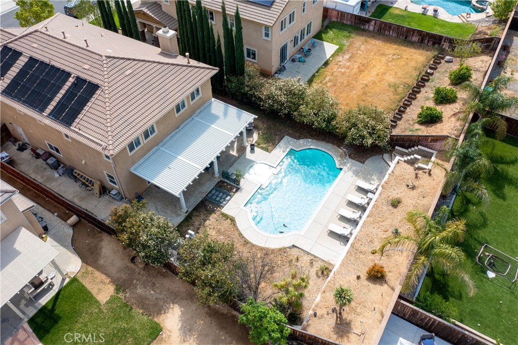 37192 High Ridge Drive Beaumont, CA 92223 - Photo 70 of 71 an aerial view of a house with a yard and potted plants