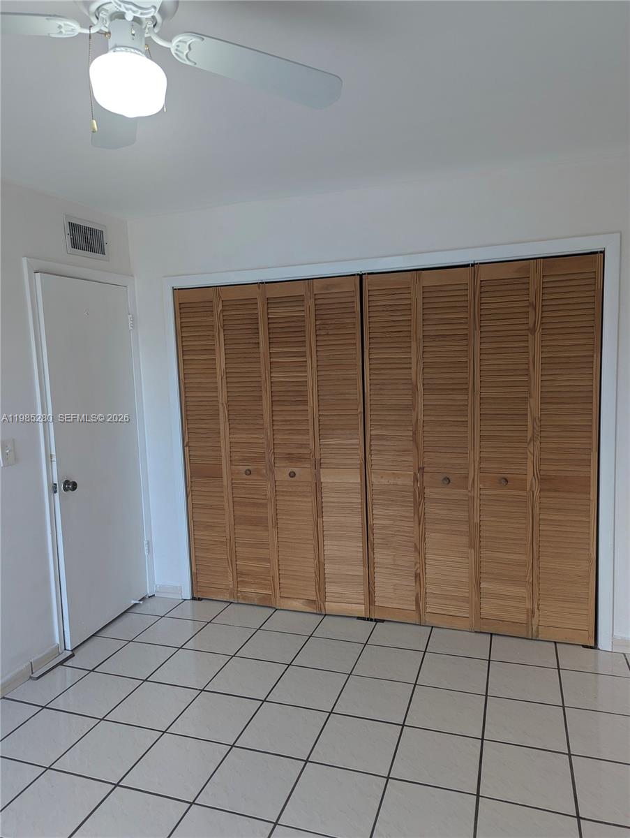 1051 Southwest 1st Street, Unit 411 Miami, FL 33130 - Photo 7 of 8 an empty room with closet