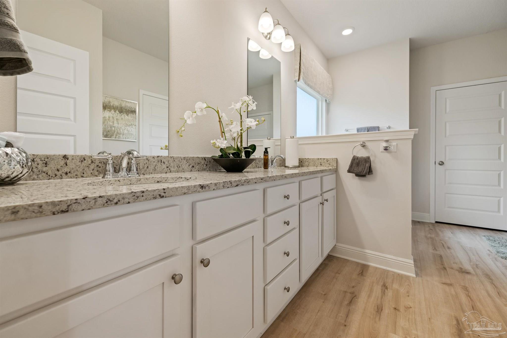 435 Connie Way Cantonment, FL 32533 - Photo 14 of 17 a bathroom with a double vanity sink mirror and shower