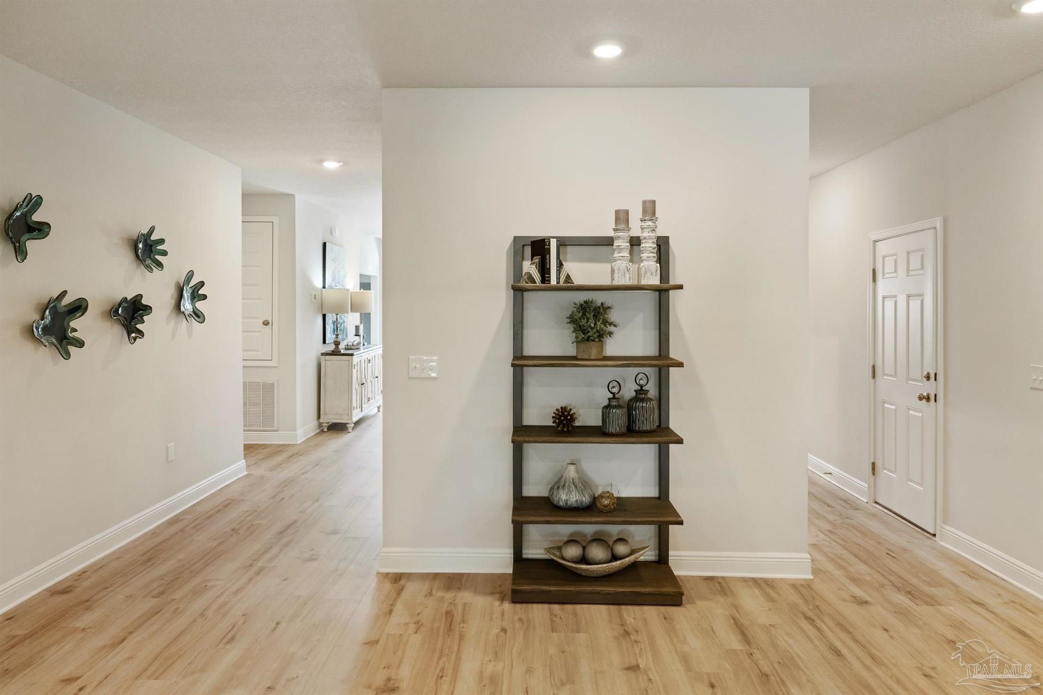 435 Connie Way Cantonment, FL 32533 - Photo 4 of 17 a room with furniture and wooden floor