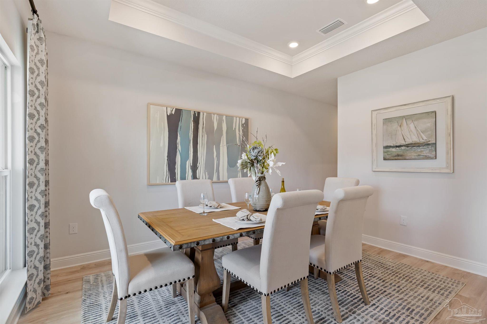 435 Connie Way Cantonment, FL 32533 - Photo 6 of 17 a view of a dining room with furniture and wooden floor