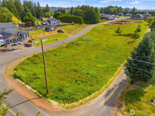 a view of a swimming pool with a lawn chairs