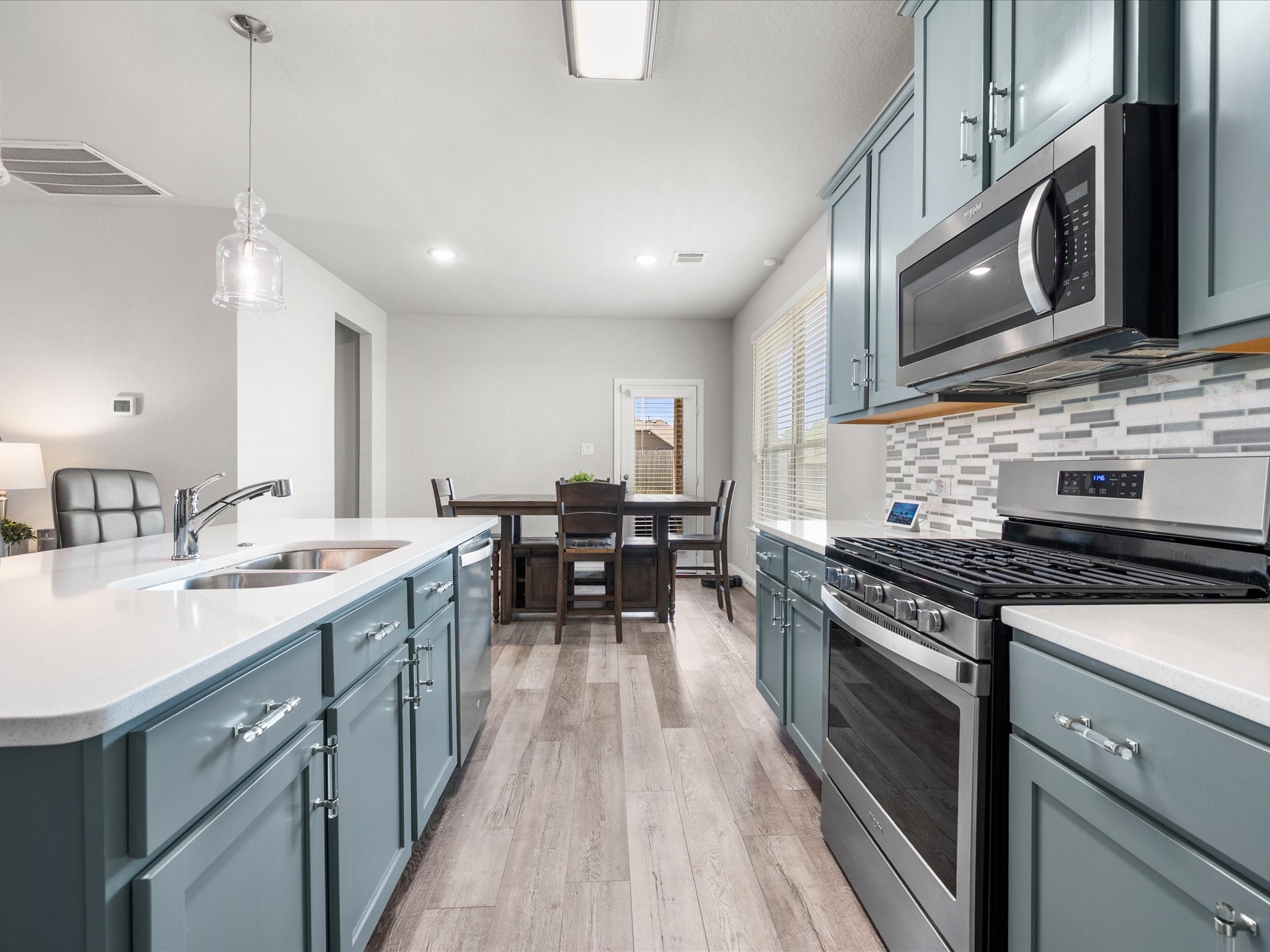 7123 Poppyseed Trail Spring, TX 77379 - Photo 11 of 30 With a gas range, abundant cabinet storage, and generous prep space, this kitchen is ready for everything from busy mornings to home-cooked dinners.