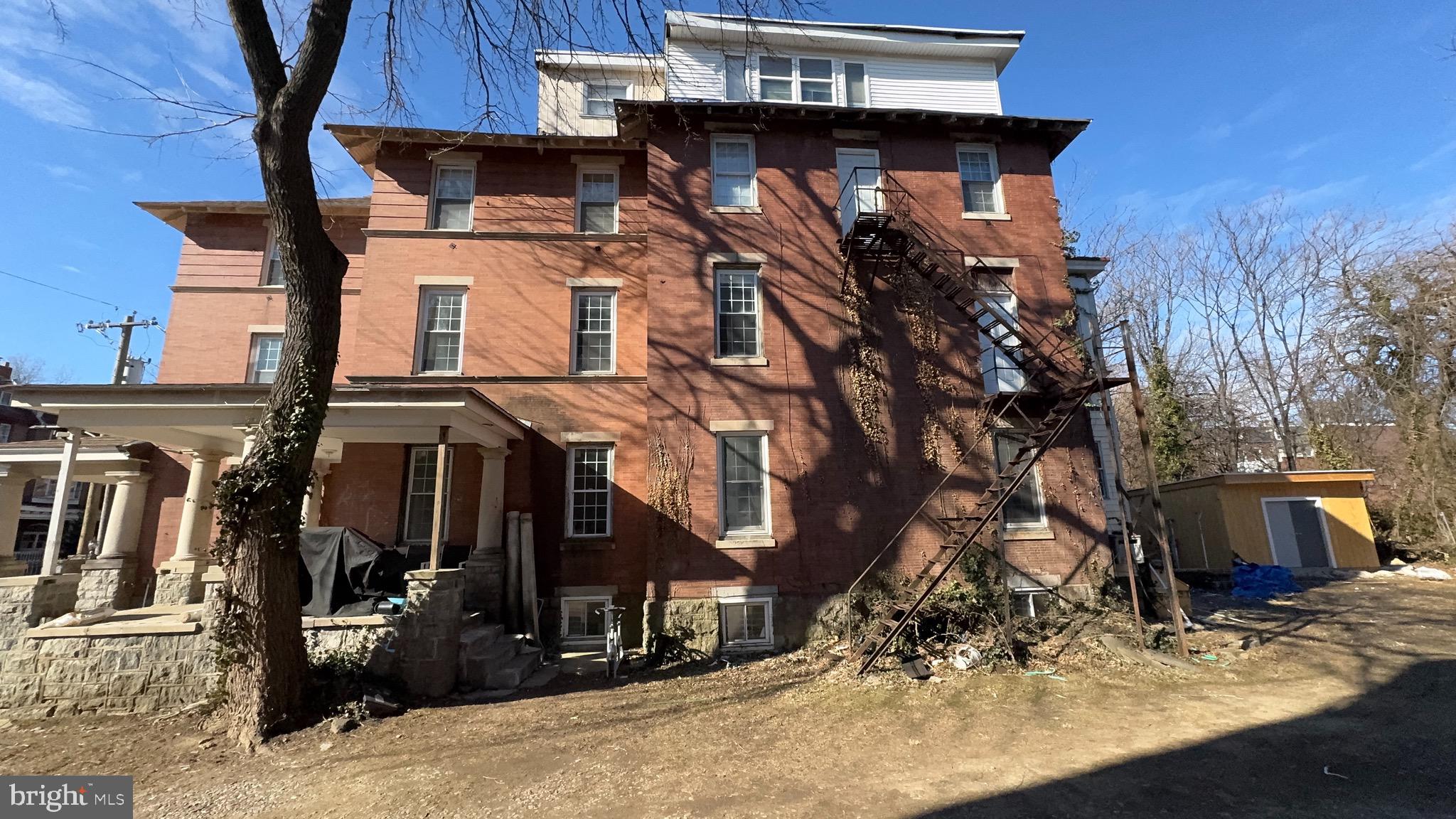 5015 Pine Street Philadelphia, PA 19143 - Photo 8 of 14 a view of a house with street