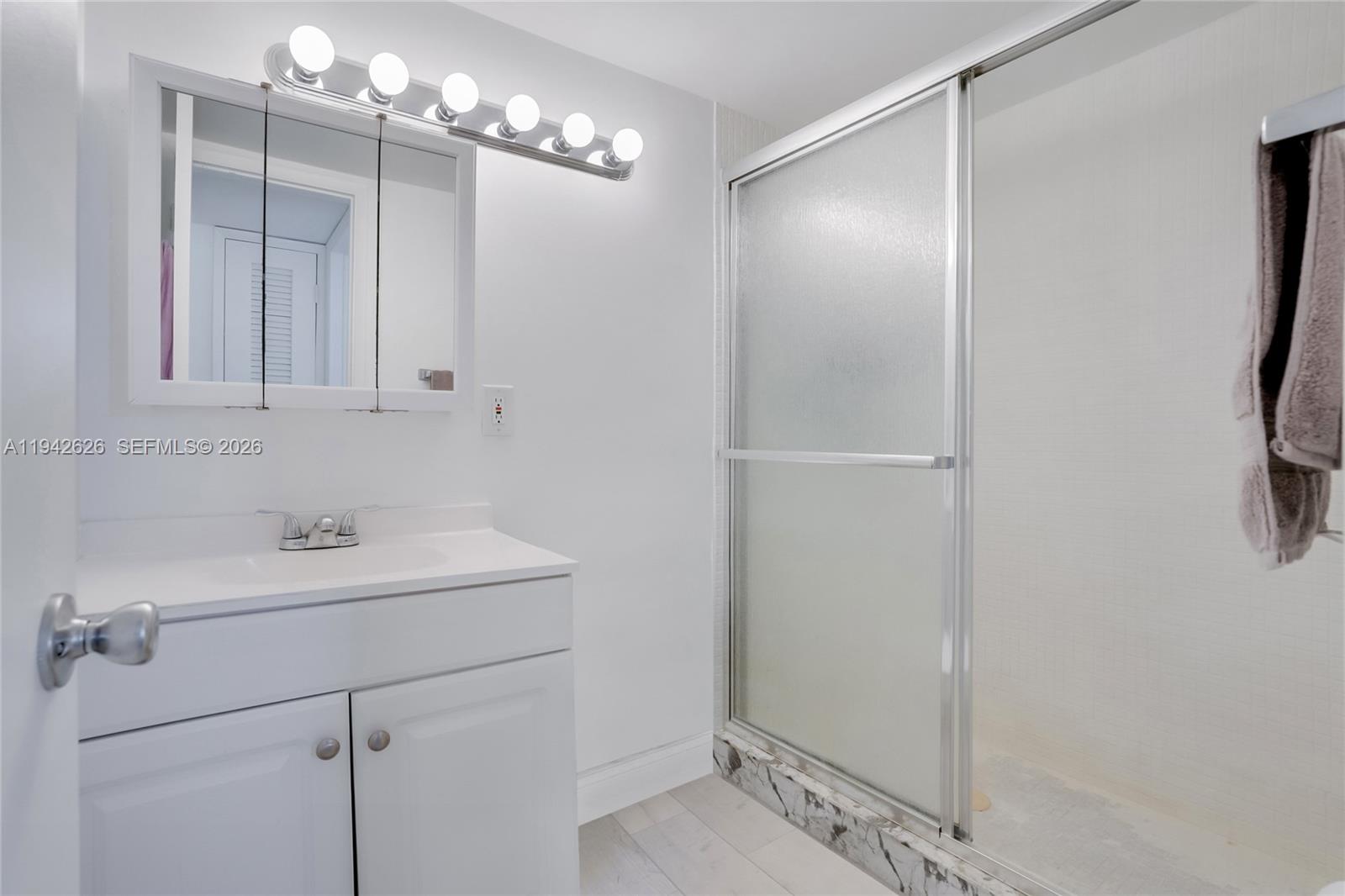 4502 North Federal Highway, Unit 334D Lighthouse Point, FL 33064 - Photo 13 of 15 a bathroom with a sink and a mirror